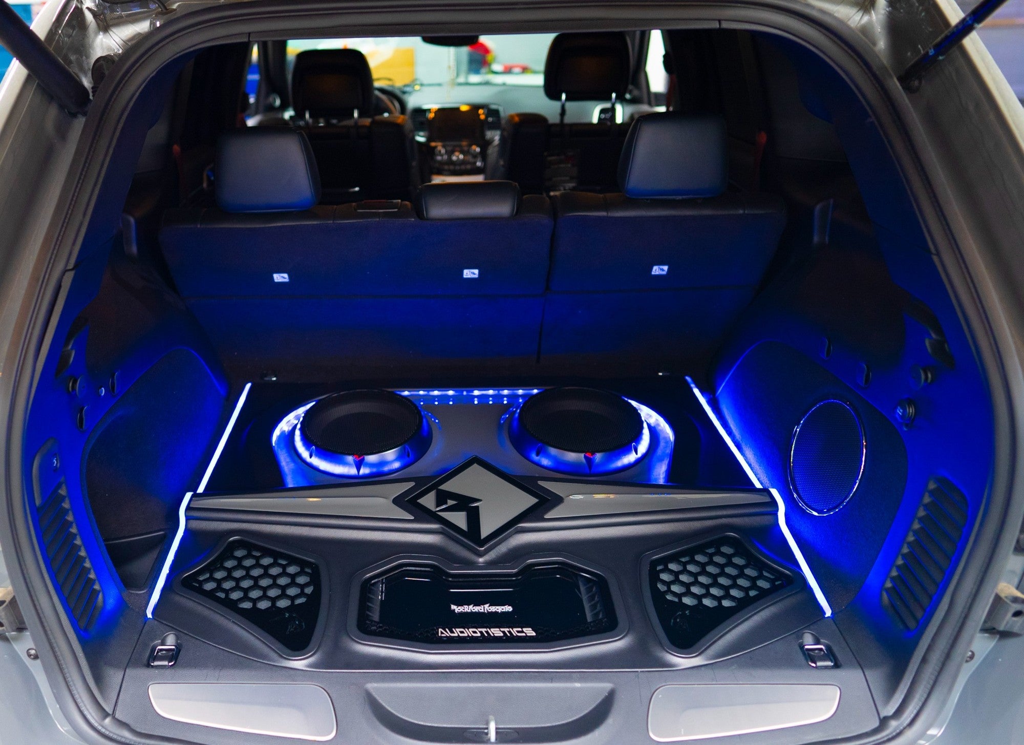 Audiotistics custom Trackhawk audio installation with blue illumination